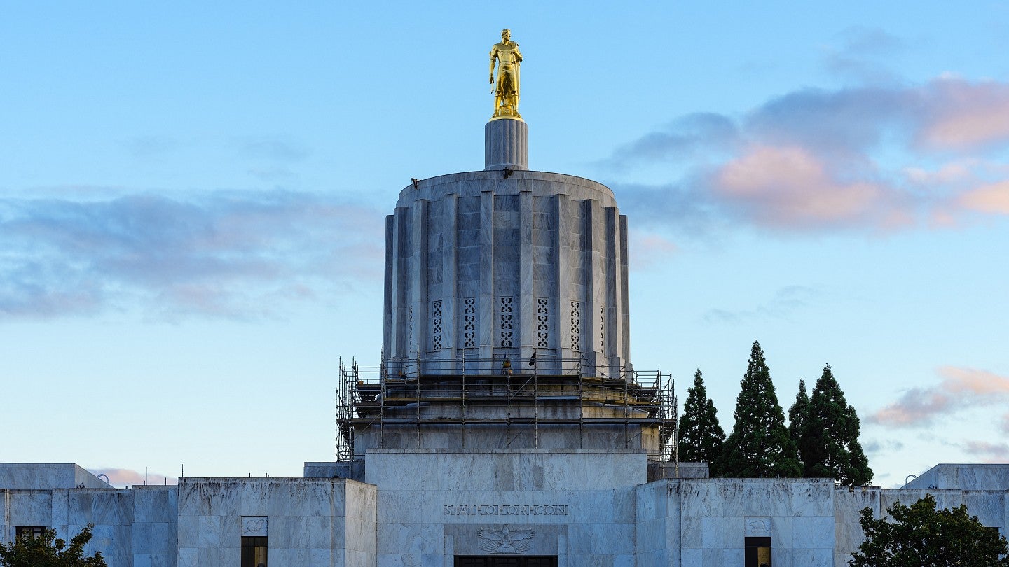 Oregon State Capital building with focus on gold statue.