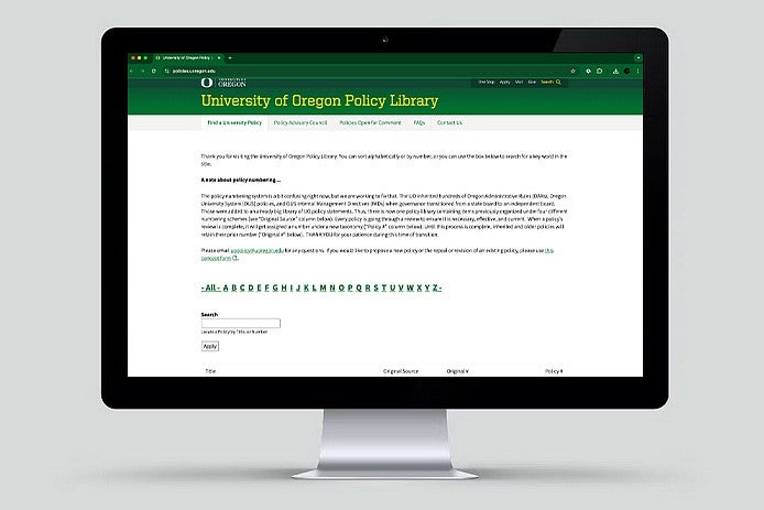 a desktop computer monitor with the UO Policy Library website on the screen