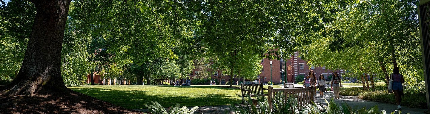 people walking on the University of Oregon campus in Eugene on a sunny day